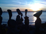 photo of balanced rocks along coast